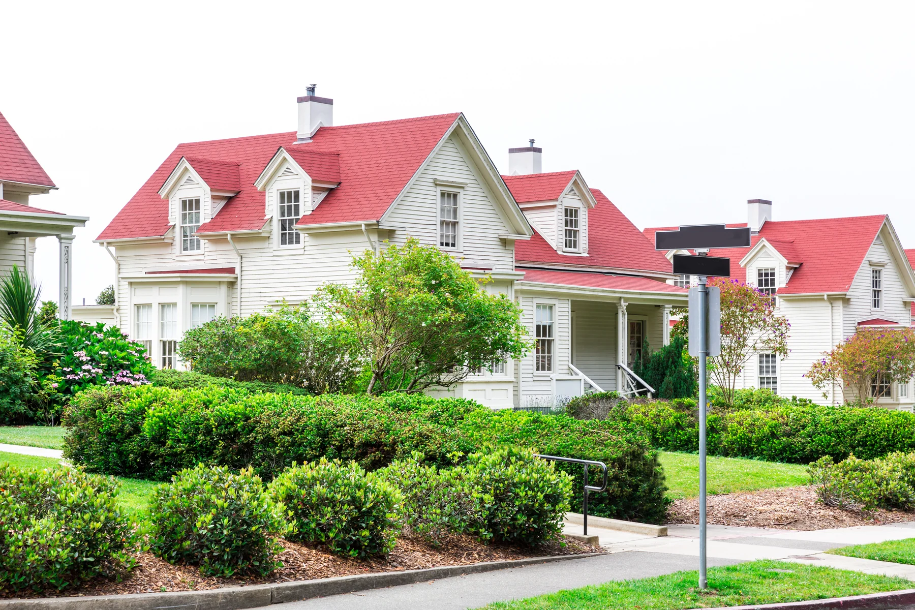 Landscaped white Southern residence prepared for a thoughtful sale